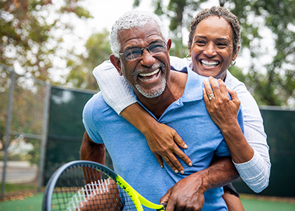 Couple playing tennis