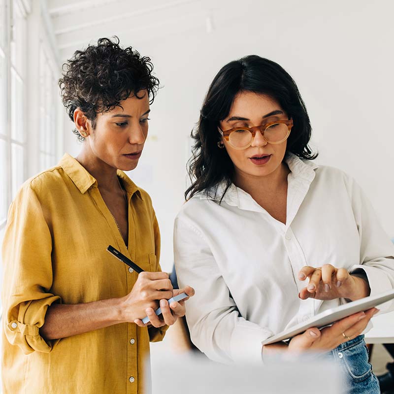 Colleagues working together on a tablet